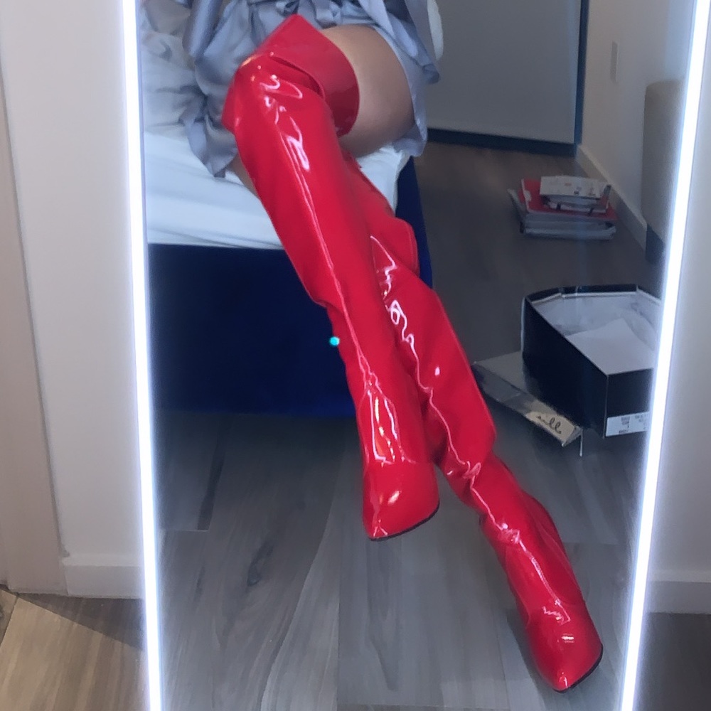 Red patent thigh high boots. Never worn. BLACK FRI